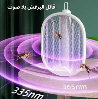 Insect killer with LED light on a table, showing captured insects and labeled wavelengths.